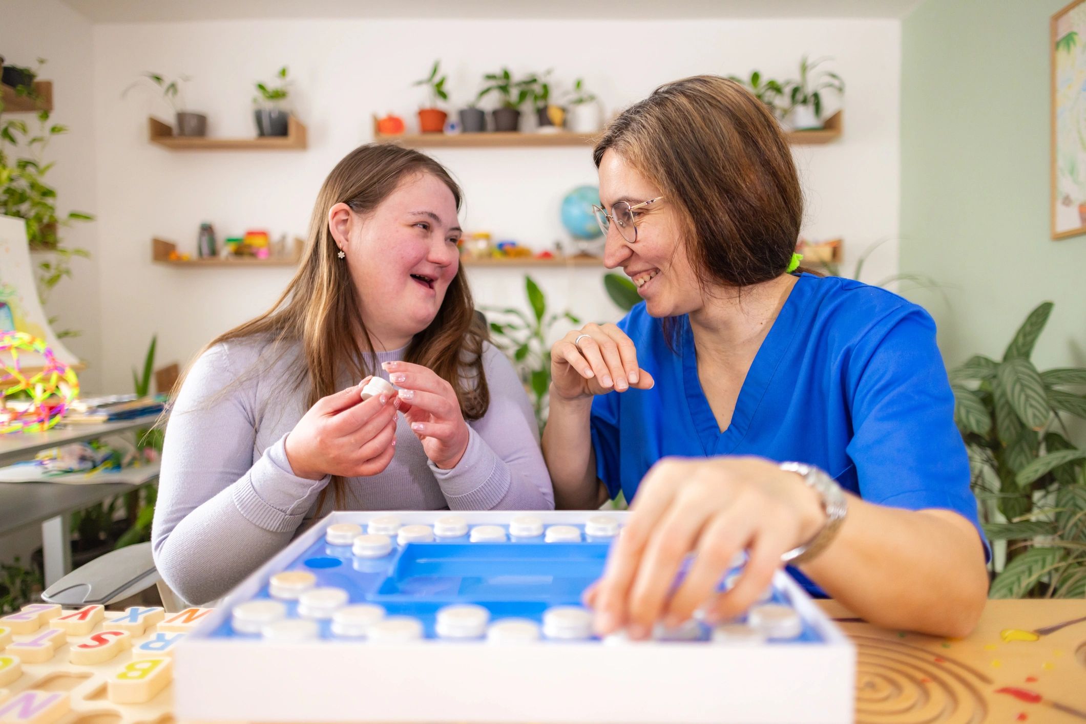 Two women engaged in educational therapeutic activity