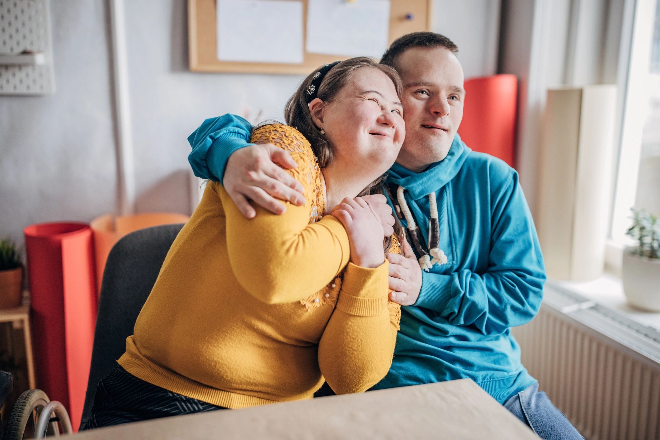 Support worker with person with Down syndrome